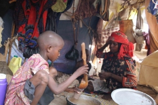 IDP Child Preparing Food